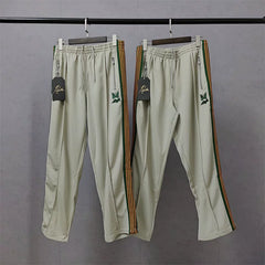 Needles x Aip Butterfly Embroidered Stripe Track Pants