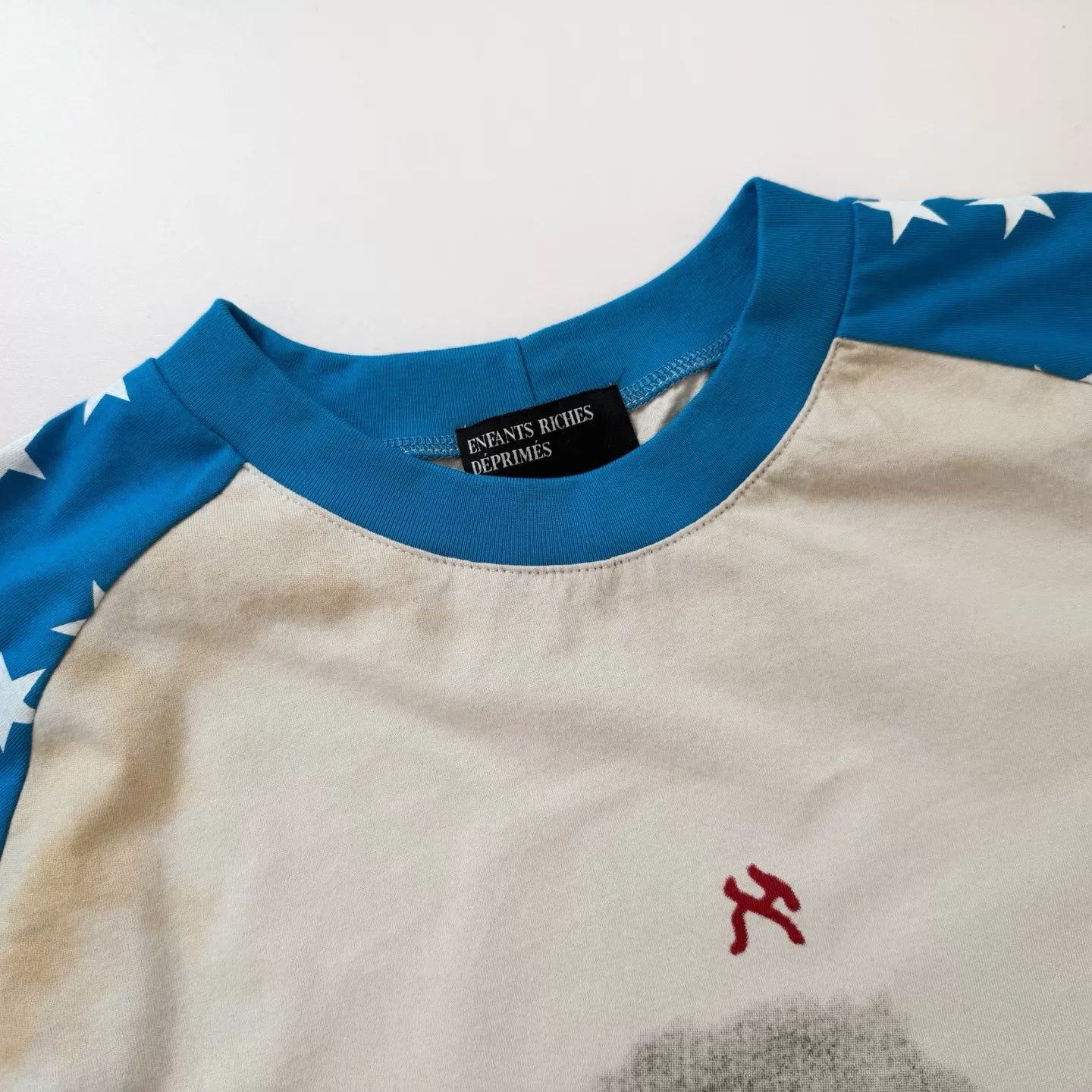 ERD's melancholic Distressed Star Raglan Graphic Tee